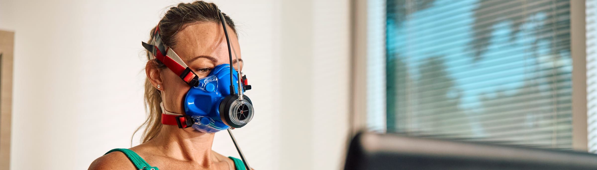 Patient wearing a VO2 max mask during metabolic testing at Preamble Health
