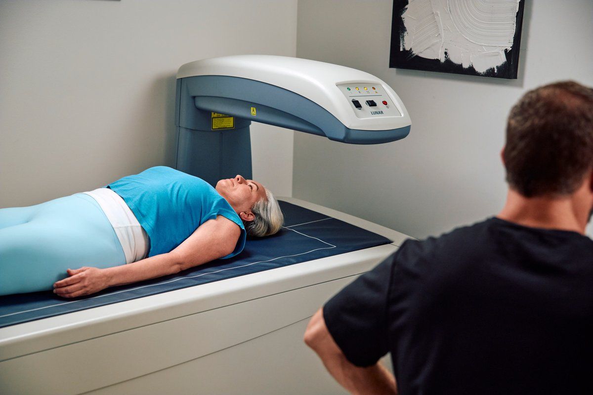 Patient lying on the DEXA scanner during a body composition scan