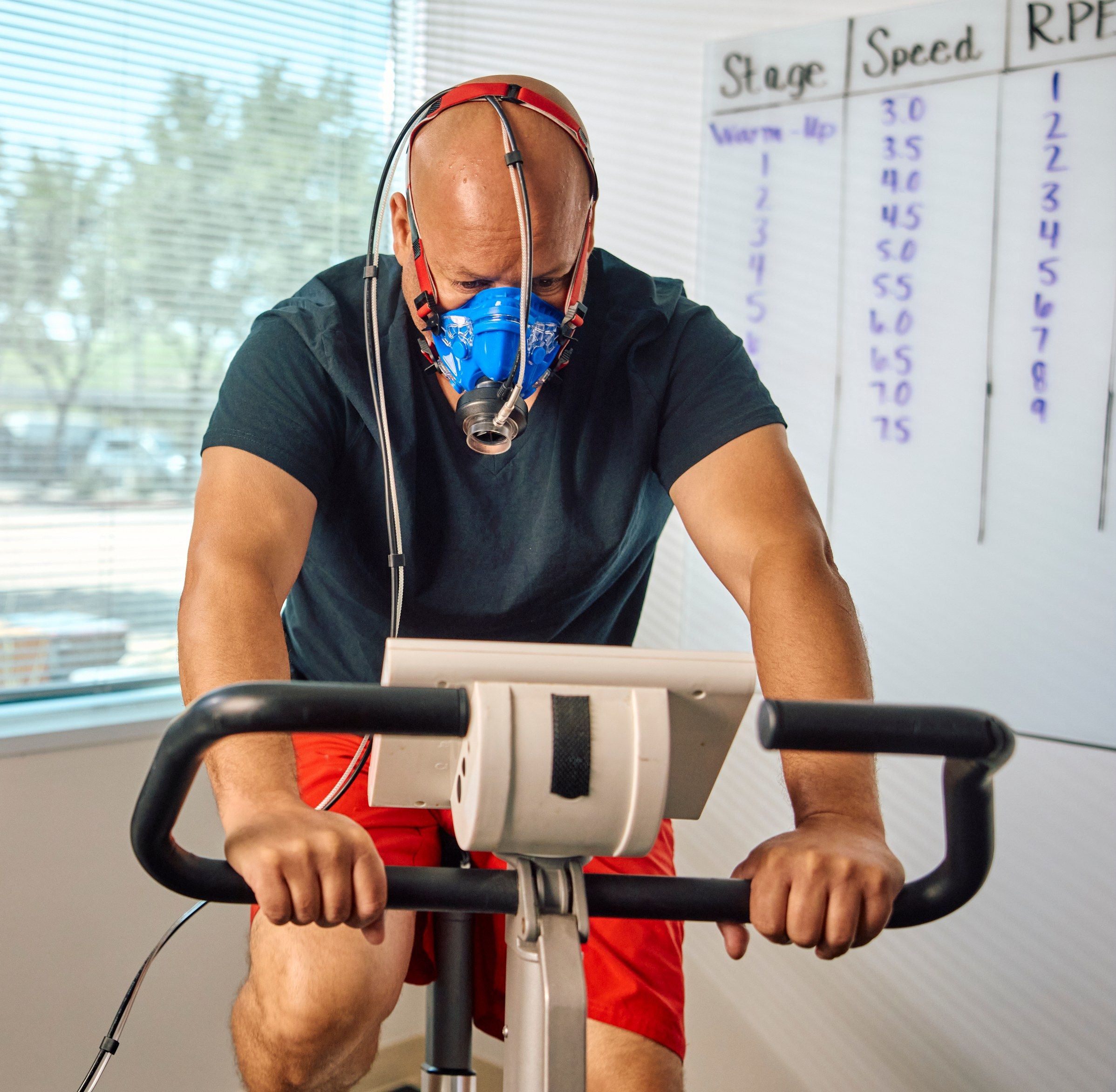 Patient performing a cardio fitness test on a stationary bike at Preamble Health